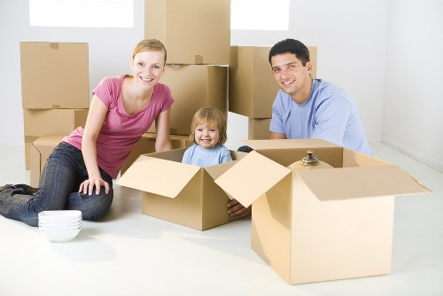 Boxes and furniture being assessed for transparent Southhackney storage pricing
