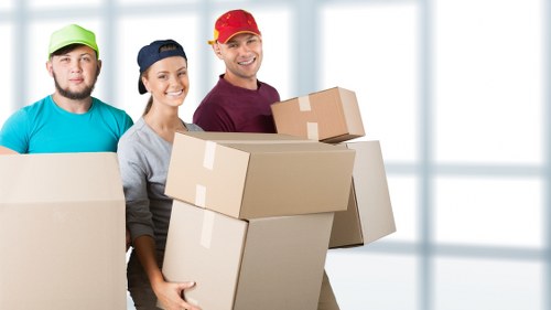 Professional flat removals in Southhackney with boxes and furniture being moved safely