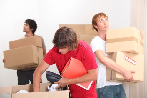 Professional movers packing boxes for a Southhackney relocation