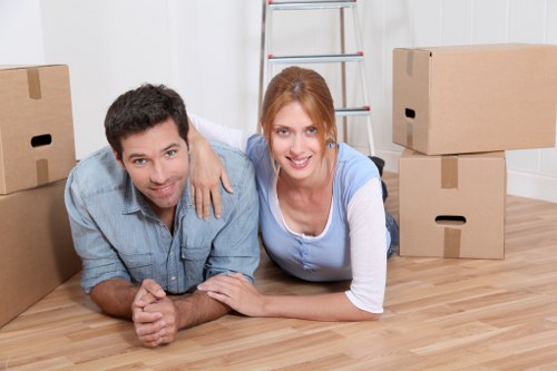Local removals crew transporting household items through Southhackney