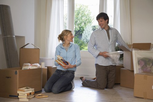 Professional movers handling furniture during a Southhackney small move