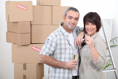 Team preparing a Southhackney flat move with labelled boxes and furniture